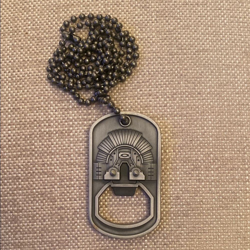Oakley Gray Metal Bottle Opener Necklace. Two-sided.